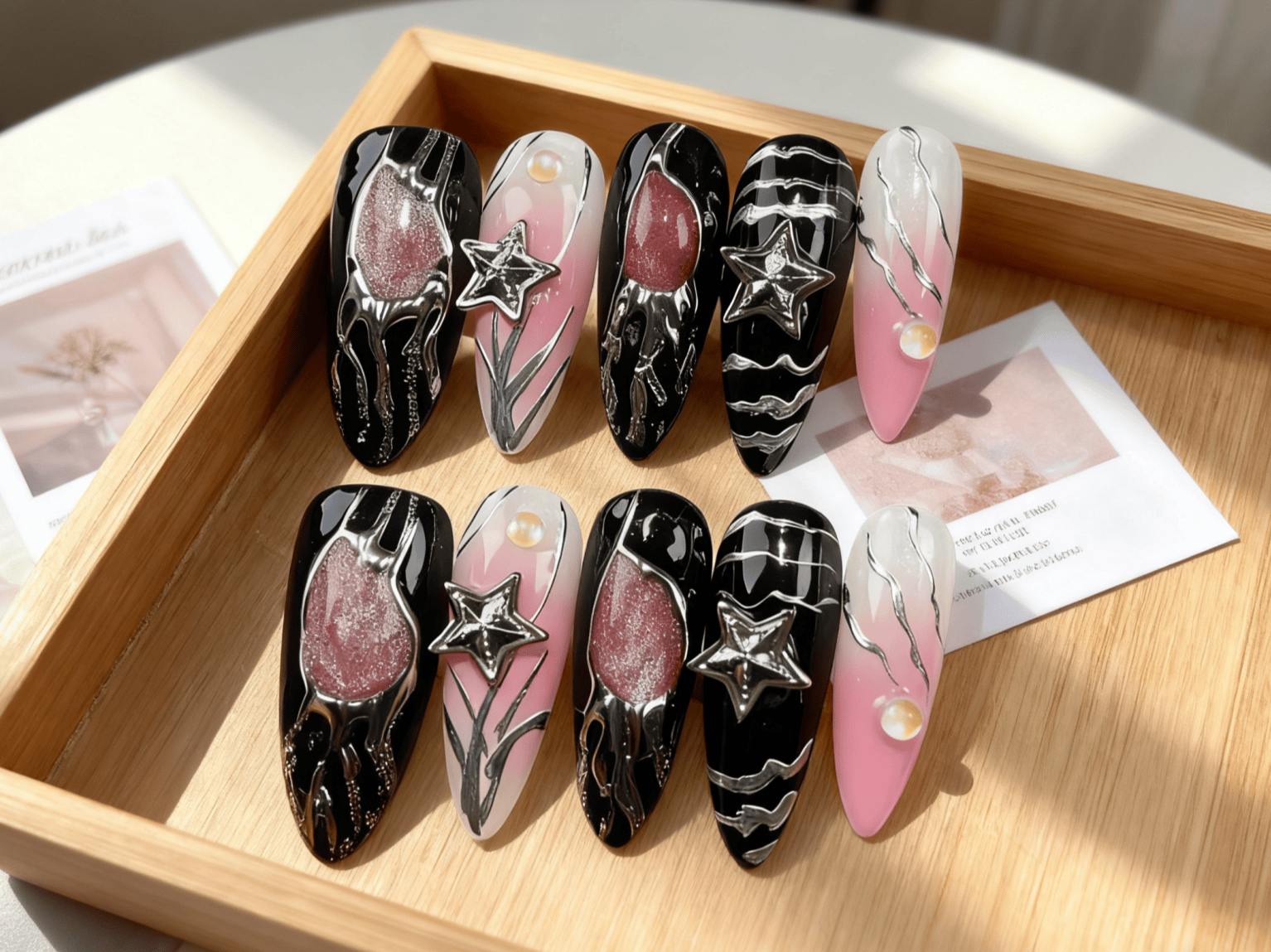 Bold Black and Pink Long Almond Press-on Nails, Star Accents & Artistic Silver Detailing for Unique Style
